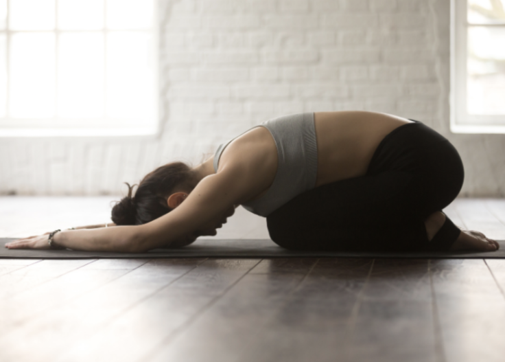 Woman Stretching on Mat