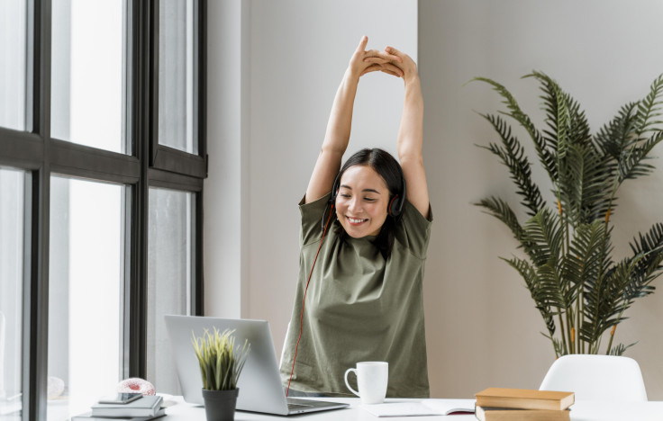 Woman stretching on work break