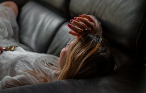 Woman lying on couch