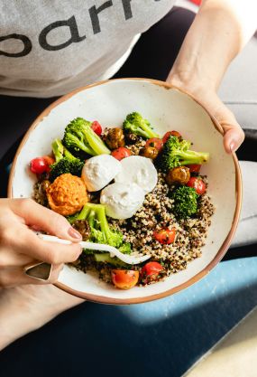 Person Holding a Bowl of Food