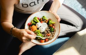 Person Holding a Bowl of Food