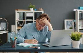 Man Looking Stressed at Work