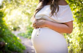 Pregnant Woman Standing Near Plants