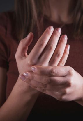 Woman Holding Her Hand