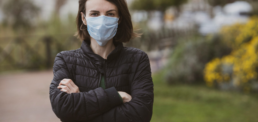 Woman with a Black Jacket Wearing Mask