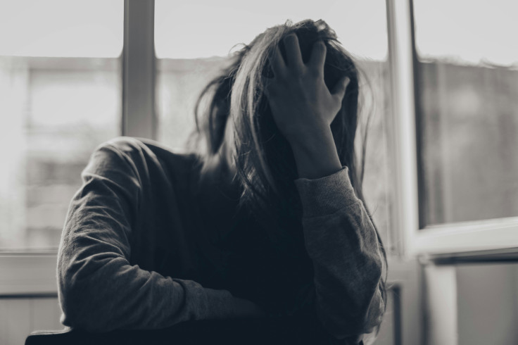 Person Covering Face with Hair