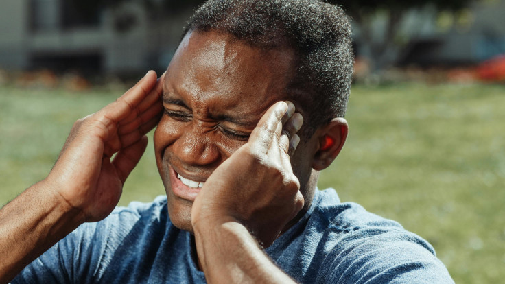 A Man with His Hands on His Head