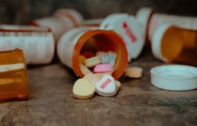 Pills Spilling Out of Container
